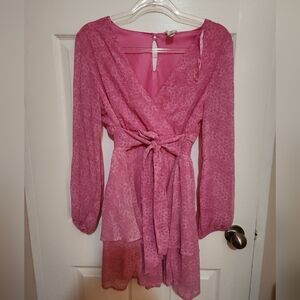 Pink ruffles dress with waist ribbon